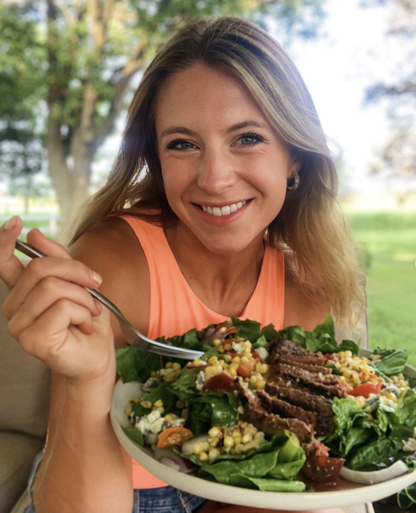 Emily eating Summer Steak Salad